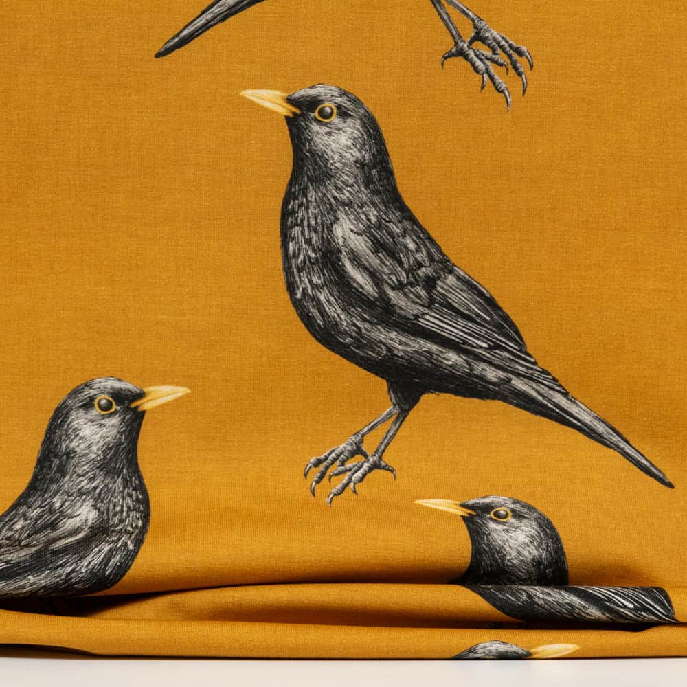 Vuorella kangaskauppa - Mustarastas trikoo keltainen