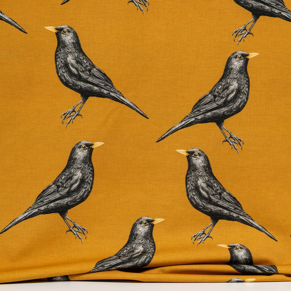 Vuorella kangaskauppa - Mustarastas trikoo keltainen