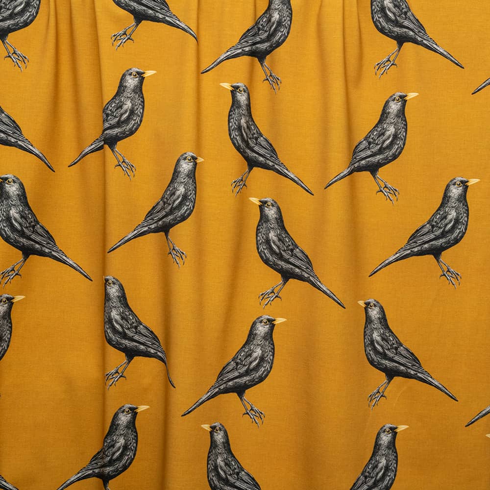 Vuorella kangaskauppa - Mustarastas trikoo keltainen