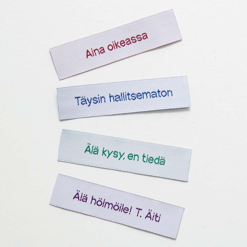 Vuorella kangaskauppa -Ompelumerkit, valkoiset