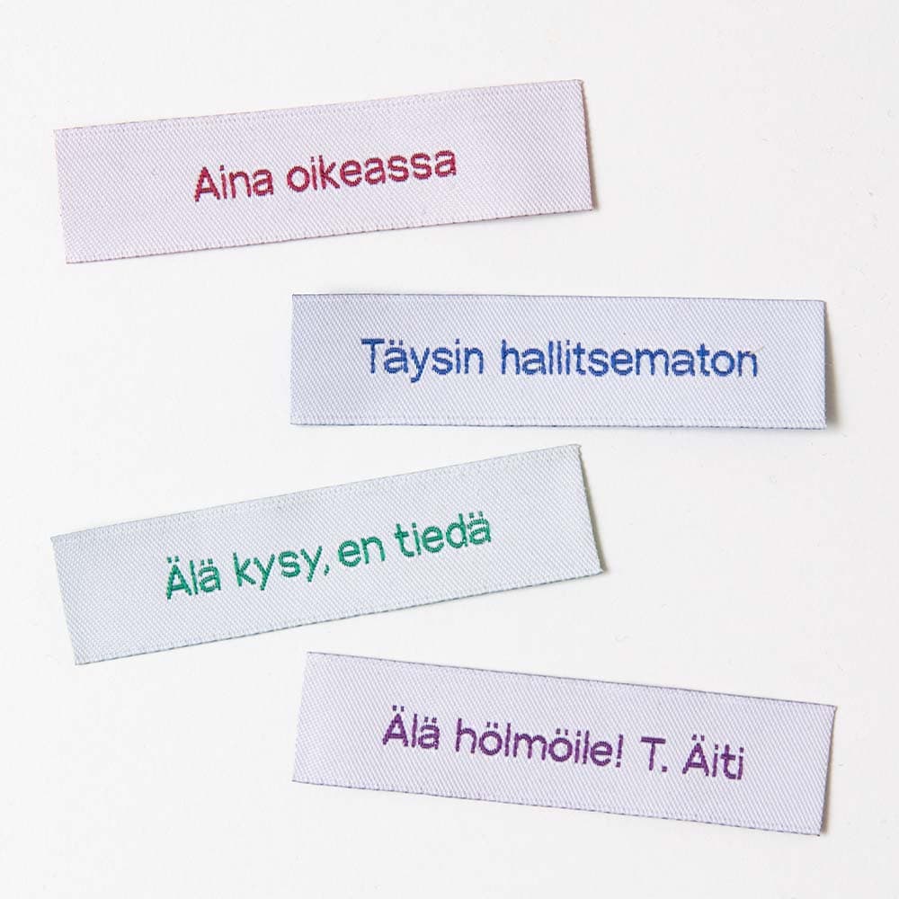 Vuorella kangaskauppa -Ompelumerkit, valkoiset